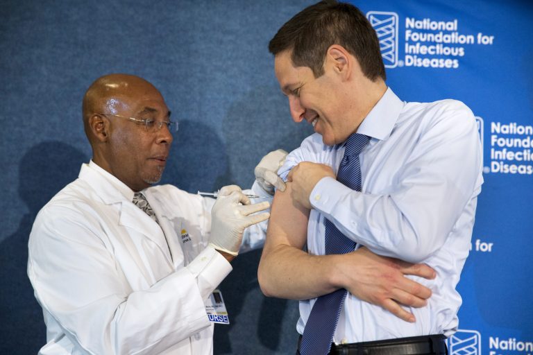 Centers for Disease Control and Prevention Director Dr. Tom Frieden, right, receives a flu shot from nurse B.K. Morris during an event about the flu vaccine, Thursday. (AP Photo/Jacquelyn Martin)