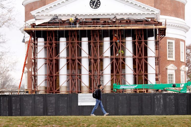 A student walks past a building under construction on the University of Virginia campus on December 6, 2014 in Charlottesville, Va. (Photo by Jay Paul/Getty images)