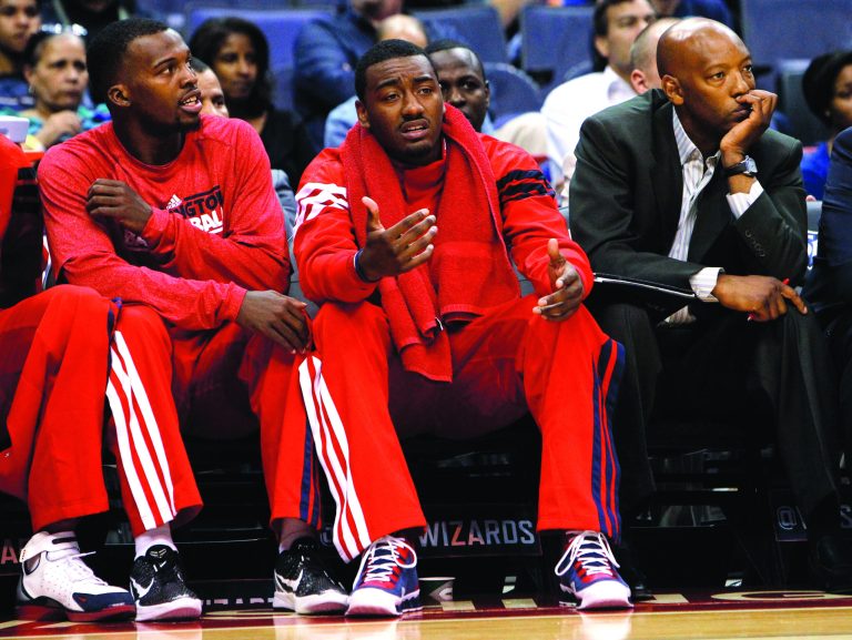 Ann Heisenfelt/AP
Wizards point guard John Wall, right, will be out another month with a knee injury.