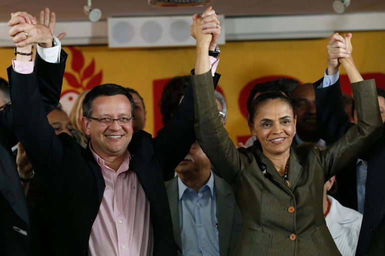 Brazilian Socialist Party (PSB) presidential candidate Marina Silva, right, and her running mate Beto Albuquerque, celebrate the launch of their candidacy for the presidential elections at the headquarters of the Brazilian Socialist Party in Brasilia, Brazil, Wednesday, Aug. 20, 2014. (AP Photo/Eraldo Peres)