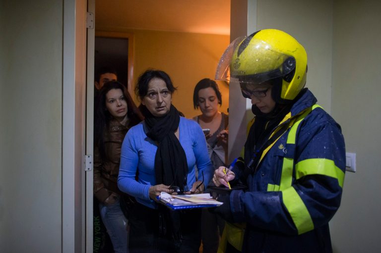 In this Feb. 24, 2014 file photo, Antonia Ortega 50 years old, centre, receives a letter from court re-confirming her and her family's  eviction as they wait for the police to arrive, in Madrid, Spain. Economic growth across Europe is expected to be slightly stronger this year as the recovery gains ground, according to the European Commission's new forecast released Tuesday, Feb. 25, 2014. 