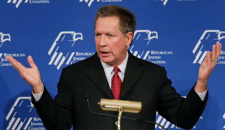 Ohio Gov. John Kasich has signed a bill aimed at improving military veterans' and service members' access to higher education and jobs. It's also intended to help prevent military identity fraud and theft.  (AP Photo/Julie Jacobson)