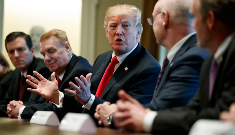 President Trump announced a 25 percent tariff on steel imports and a 10 percent tariff on aluminum products as GOP senators met for lunch, leaving many in the dark on the planned executive order. (AP Photo/Evan Vucci)