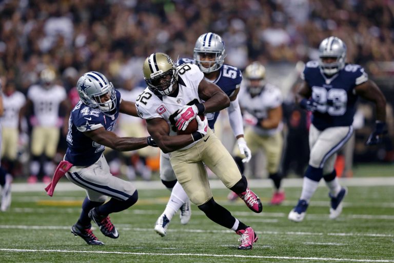 New Orleans Saints tight end Benjamin Watson (82) carries past Dallas Cowboys strong safety Barry Church (42) in the first half of an NFL football game in New Orleans, Sunday, Oct. 4, 2015. (AP Photo/Brynn Anderson)