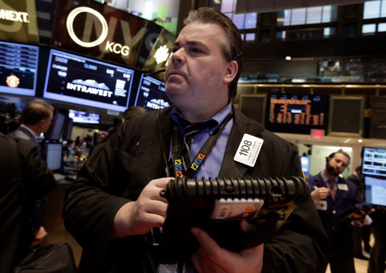 Trader Robert Hannan works on the floor of the New York Stock Exchange Friday, Jan. 31, 2014. Stocks fell sharply in early trading Friday, as investors fretted over disappointing earnings from companies like Amazon.com and more trouble in overseas markets. (AP Photo/Richard Drew)