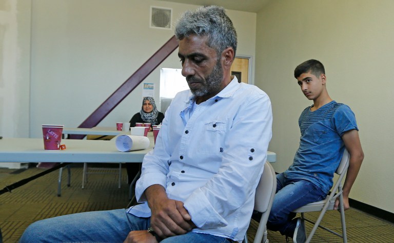Refugee assistance groups are asking volunteers to protect incoming refugees from being sent home, after President Trump issued an executive order suspending the U.S. Refugee Assistance Program for the next six months. (AP Photo/Lenny Ignelzi)