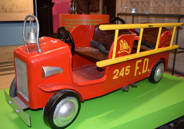 This  Sept. 8, 2014 photo provided by the Green-Wood Historic Fund shows a fire engine from an amusment park ride built by William Mangels in an exhibit of his creations at the the Green-Wood Cemetery, where he is buried, in the Brooklyn borough of New York. Mangels, who was passionate about amusement parks, built carousels, shooting ranges and other rides for Coney Island and other parks during the first quarter of the 20th century. (AP Photo/Green-Wood Historic Fund, Art Presson)