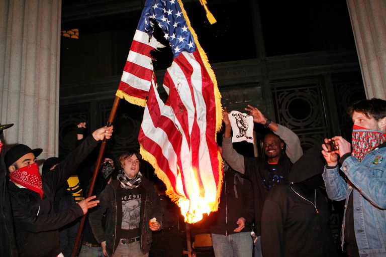 The Supreme Court ruled in 1989 that burning the American flag is a protected form of free speech. (AP Photo/Beck Diefenbach)