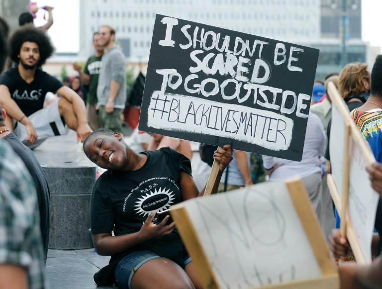 Two reporters among the dozens taken to jail. (Carlos Ortiz/Democrat and Chronicle via AP)