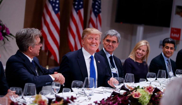 Both French energy giant Total and electronics giant Siemens told the president that they plan to invest more in the U.S. because of the Republican tax legislation. (AP Photo/Evan Vucci)
