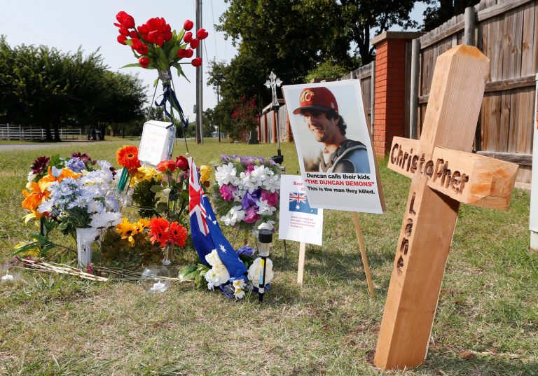 A memorial to Christopher Lane is shown Tuesday, Aug. 20, along the road where he was shot and killed, in Duncan, Okla. (AP/Sue Ogrocki)