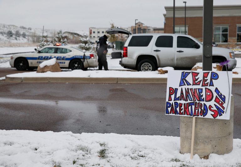 In Friday's attack, a man was charged with killing a police officer and two civilians at a Planned Parenthood center in Colorado Springs. (AP Photo/David Zalubowski)