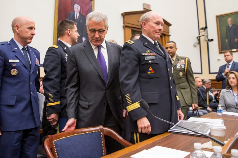 Defense Secretary Chuck Hagel, left, and Joint Chiefs Chairman Gen. Martin Dempsey arrive on Capitol Hill in Washington, Thursday, Nov. 13, 2014, to testify before the House Armed Services Committee hearing on the Islamic State group. (AP Photo/Evan Vucci)