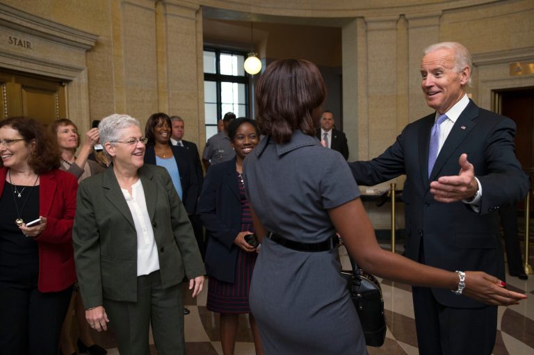 Vice President Joe Biden, right, greets Environmental Protection Agency workers as they return to work after 16 days of a government shutdown at the William Jefferson Clinton Federal Building in Washington on Thursday, Oct. 17, 2013. Thousands of furloughed federal workers returned to work across the country Thursday after 16 days off the job due to the partial government shutdown. (AP Photo/Jacquelyn Martin)