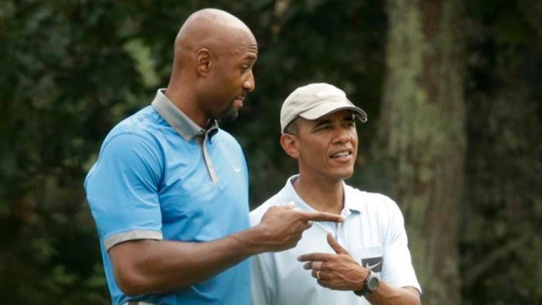 President Obama on Saturday is again golfing with former basketball great Alonzo Mourning on Martha's Vineyard Island in Massachusetts. AP Photo