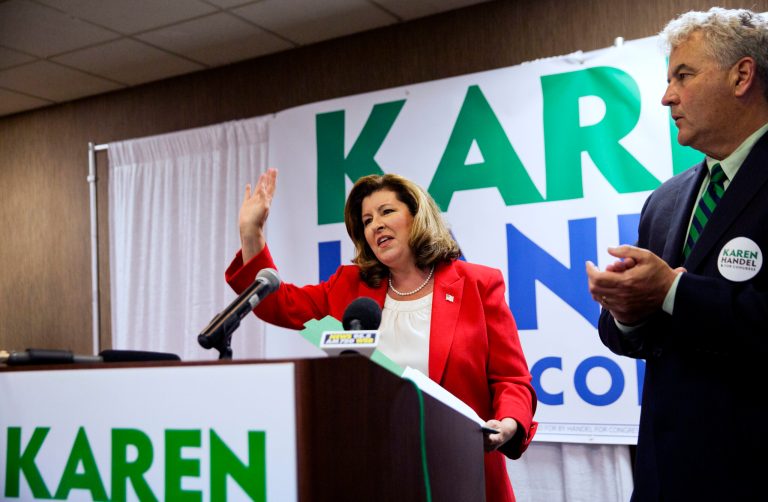 Republican candidate for Georgia's Sixth Congressional seat Karen Handel waves after speaking at an election night watch party with husband Steve, right, in Roswell, Ga., Tuesday, April 18, 2017. (AP Photo/David Goldman)