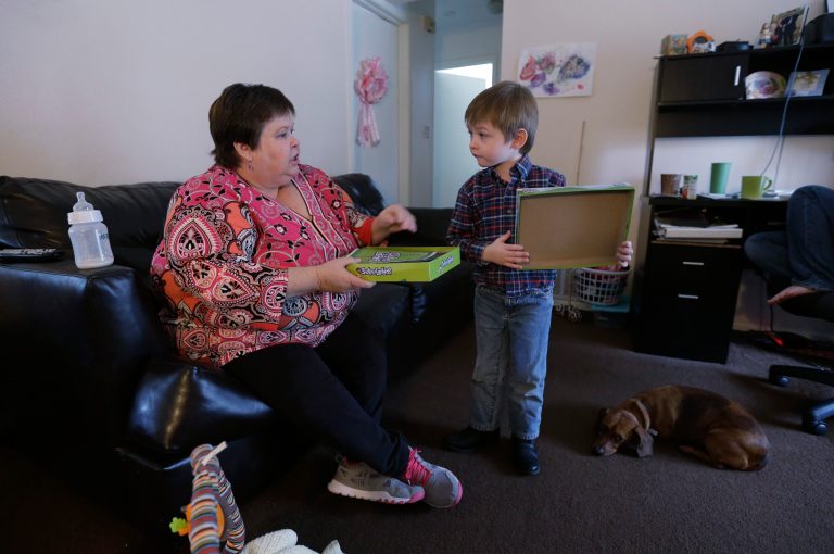 Mary-Jane Harrison plays with her grandson David, in San Antonio. (AP Photo/Eric Gay)