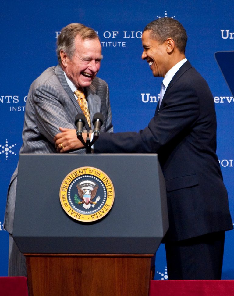 President Obama greets former president George H. W. Bush at Texas A&M University in College Station, Texas, in 2009. (Dave Einsel/Getty Images)