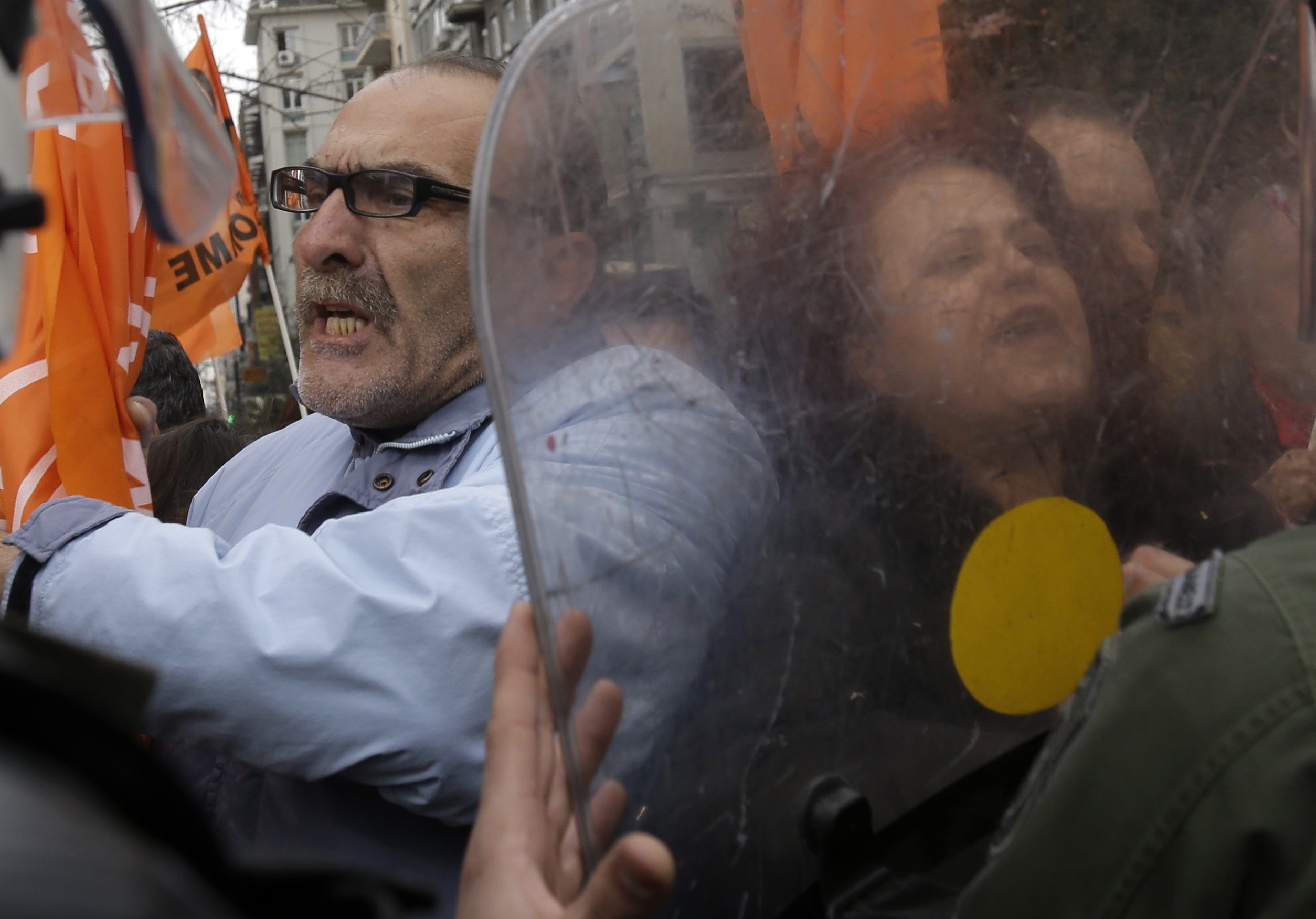 Protesters scuffle with riot police in Athens