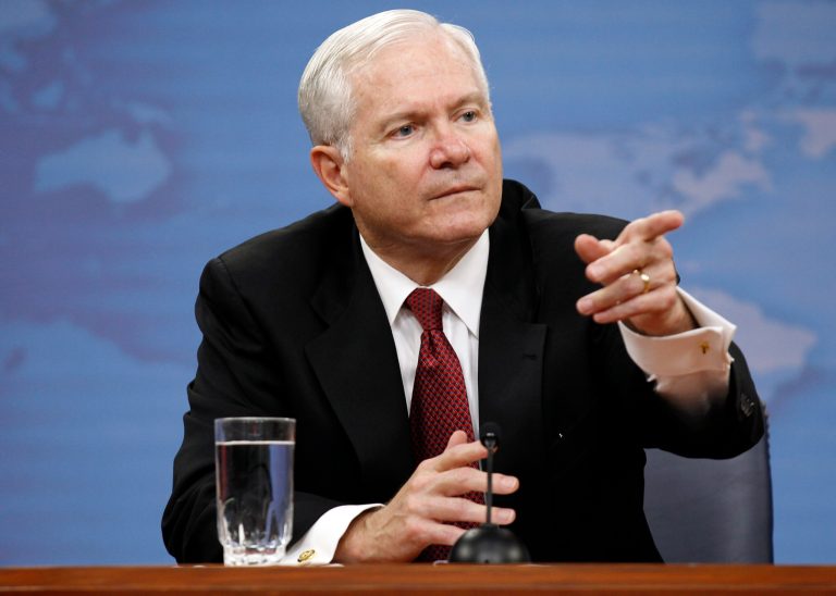 FILE - In this June, 2011 file photo, Secretary of Defense Robert Gates points to a question during a media availability at the Pentagon in Washington.  Gates says he's worried there's a perception of the United States 