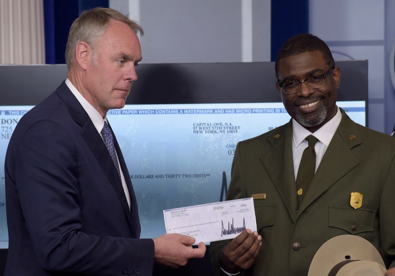 By setting aside his business empire, Trump would earn more political capital than any oversized check could purchase. (AP Photo/Susan Walsh)