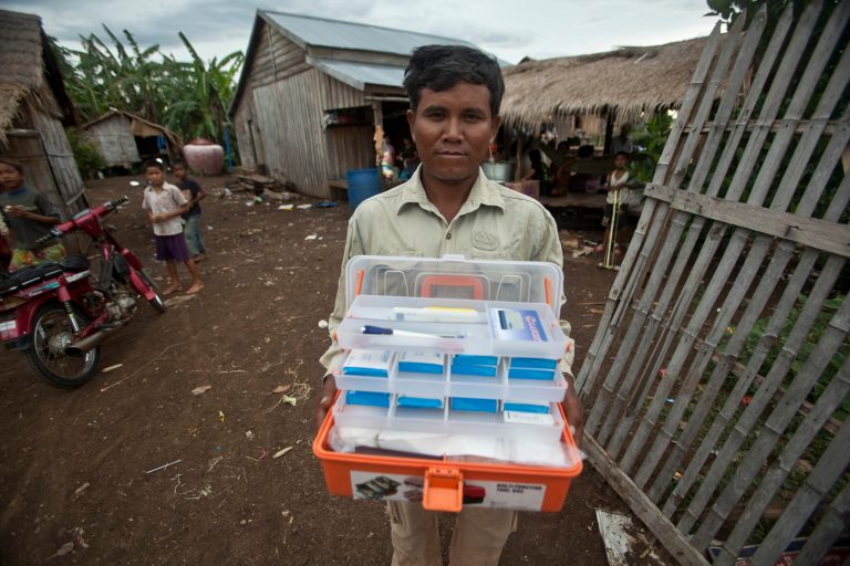 FILE - This Aug. 29, 2009 photo shows village malaria worker Phoun Sokha, 47, showing his malaria medicine kit at O'treng village on the outskirts of Pailin, Cambodia. This spot on the Thai-Cambodian border is home to a form of malaria that keeps rendering one powerful drug after another useless. This time, scientists have confirmed the first signs of resistance to the only affordable treatment left in the global medicine cabinet for malaria: Artemisinin. U.S. experts are raising the alarm over the spread of drug-resistant malaria in several Southeast Asian countries, endangering major global gains in fighting the mosquito-borne disease that kills more than 600,000 people annually. The report warns that could be a health catastrophe in the making, as no alternative anti-malarial drug is on the horizon. (AP Photo/David Longstreath, File)