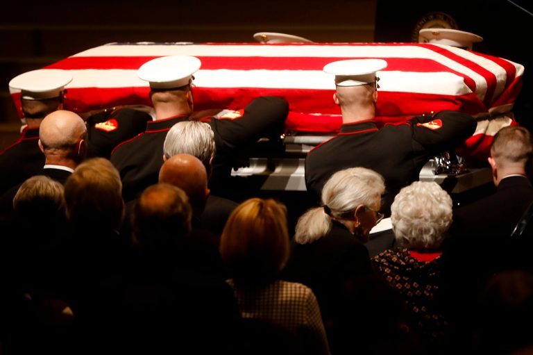 John Glenn's casket is carried by Marines into his funeral ceremony at The Ohio State University on Dec. 17 in Columbus. Glenn, the famed astronaut, died Dec. 8 at age 95. (AP Photo/John Minchillo)