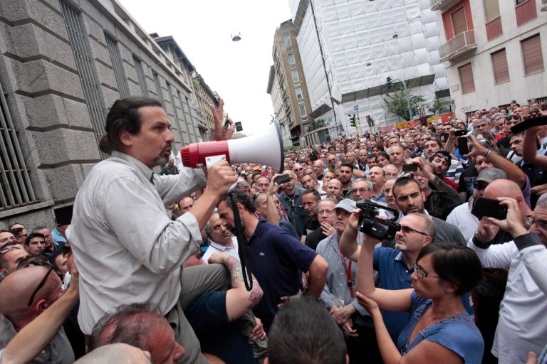 Taxi drivers protest in Milan, Italy, Wednesday, May 21, 2014. Milan's taxis have been idle for five days to protest the ride-hailing app Uber, the latest European challenge to a technological advance against old business models. Uber, a San Francisco startup, has been banned in Brussels and is under court scrutiny in Berlin. Milan's 5,000 taxi drivers are seeking similar curbs when representatives meet with Italy's transport minister Wednesday. (AP Photo/Federico Ferramola, Lapresse) ITALY OUT