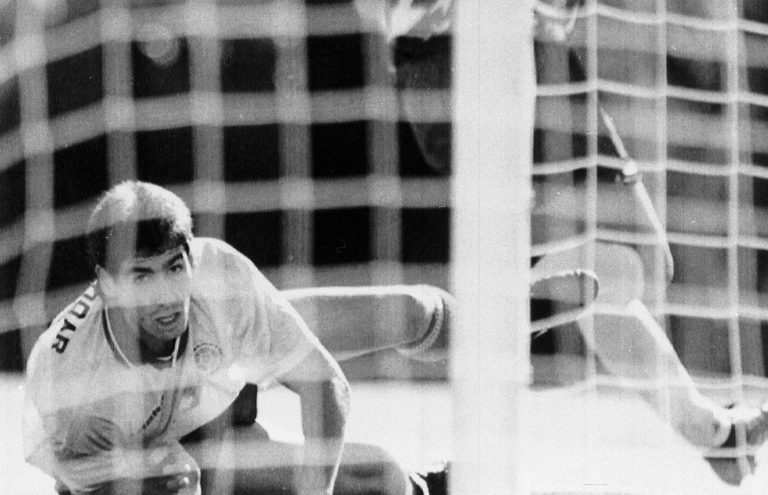 FILE - In this June 22, 1994 file photo, Colombia's Andres Escobar, lies on the ground and watches as a shot by America's Eric Wynalda misses the goal, during their World Cup soccer match, in the Rose Bowl, Pasadena, USA. The US defeated Colombia by 2-1. On this day: July 2, Escobar was shot dead in his home town of Medellin. The killing appeared to be directly linked to Escobar's own goal scored during Colombia's 2-1 defeat to the US. As a result, Colombia returned home early from a tournament many had expected it to do well in. (AP Photo/Eric Draper, File)