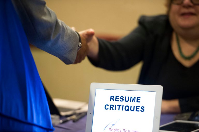 FILE -  In this Thursday, May 30, 2013, photo, a job seeker stops at a table offering resume critiques during a job fair held in Atlanta. The Labor Department reports on the weekly jobless claims on Thursday, April 17, 2014. (AP Photo/John Amis, File)