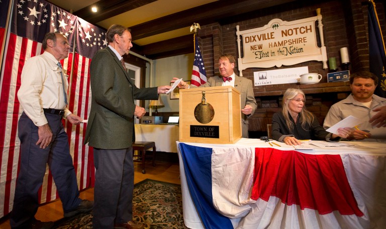 Voters in Dixville Notch, Va., cast their ballots just after midnight Tuesday, Nov. 8, 2016, in Dixville Notch, N.H. (AP Photo/Jim Cole)