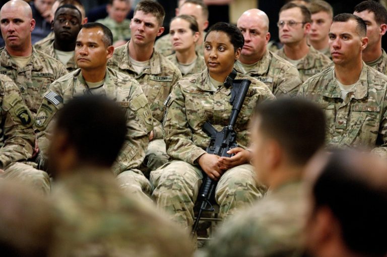 Soldiers listen to U.S. Defense Secretary Ash Carter at Kandahar Airfield in Afghanistan, Sunday, Feb. 22, 2015. (AP Photo/Jonathan Ernst, Pool)