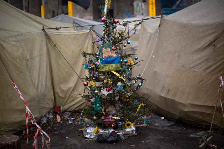 A christmas tree is seen in the middle of tents set by opposition supporters in Kiev's Independence Square, the epicenter of the country's current unrest, Ukraine, Friday, Feb. 7, 2014. Ukrainian protesters lambasted parliament on Thursday for its lack of action, and a senior U.S. diplomat arrived in Kiev to try to help find a resolution to the country's grinding political crisis. Assistant Secretary of State Victoria Nuland met separately with President Viktor Yanukovych and with opposition leaders during her two-day stay in the Ukrainian capital. (AP Photo/Emilio Morenatti)