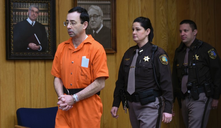 In this January photo, Larry Nassar (pictured left) enters Judge Janice Cunningham's circuit courtroom in Charlotte, Mich. He was later convicted and sentenced for sexually abusing young gymnasts for more than a decade. This week, the House Oversight and Government Reform Committee sent letters asking for information related to the sexual abuse scandal. (Matthew Dae Smith/Lansing State Journal via AP)