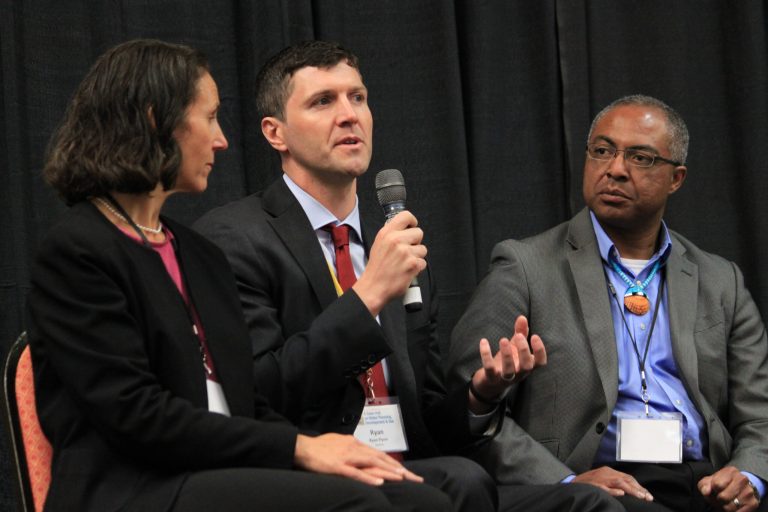 New Mexico Environment Department Secretary Ryan Flynn, center, discusses water quality issues around the state as Laguna Pueblo Gov. Richard Luarkie and Luara McCarthy of The Nature Conservancy listen during a town hall in Albuquerque, N.M. on Tuesday, April 15, 2014. Hundreds of state officials, water managers, researchers and others were participating in the two-day meeting with the goal of developing a series of recommendations as New Mexico grapples with drought. (AP Photo/Susan Montoya Bryan)