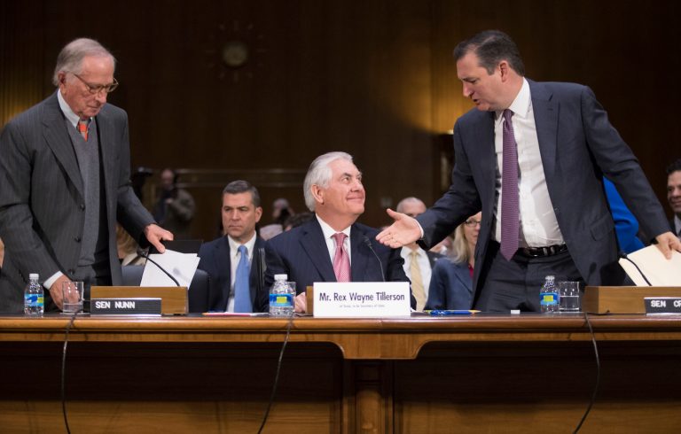 Secretary of State-designate Rex Tillerson, center, is flanked by former Democratic Georgia Sen. Sam Nunn and Sen. Ted Cruz, R-Texas, right, who introduced him on Capitol Hill in Washington, Wednesday, Jan. 11, 2107, at his confirmation hearing before the Senate Foreign Relations Committee. (AP Photo/J. Scott Applewhite)