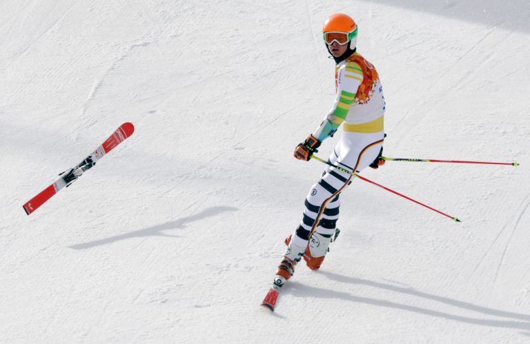 Germany's Stefan Luitz arrives in the finish area on one ski after hitting a gate in the first run of the men's giant slalom at the Sochi 2014 Winter Olympics, Wednesday, Feb. 19, 2014, in Krasnaya Polyana, Russia.  (AP Photo/Gero Breloer)