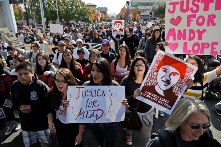 Protesters march in Santa Rosa, Calif., on Oct. 29 to protest the fatal shooting of a 13-year-old boy by a sheriff's deputy. (AP Photo/Marcio Jose Sanchez)