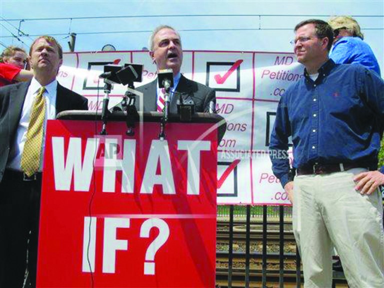 Baltimore County State's Attorney Scott Shellenberger, center, announces a petition drive to try to overturn a repeal of Maryland's death penalty on Friday, May 3, 2013 in Baltimore, a day after Gov. Martin O'Malley signed a repeal bill into law. State Sen. James Brochin, D-Baltimore County, left, and Delegate Neil Parrot, R-Washington, also are hoping to overturn the repeal. Parrott says the purpose of the sign is to ask state residents whether they would prefer to have the death penalty on the books, if a terrorist attack happened in Maryland. (AP Photo/Brian Witte)