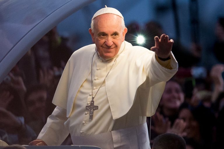 Pope Francis waves from the Popemobile on his way to attend the Via Crucis on Copacabana Beach during World Youth Day celebrations on July 26, 2013 in Rio de Janeiro, Brazil. (Photo by Buda Mendes/Getty images)