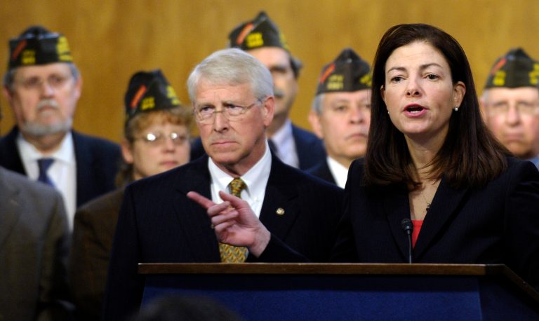 Sen. Kelly Ayotte, R-N.H., urges her Senate colleagues to maintain benefits to retired servicemembers, in a news conference on Capitol Hill in Washington on Dec. 17. (AP Photo/Susan Walsh)