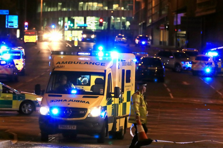 Emergency services work at Manchester Arena after reports of an explosion at the venue during an Ariana Grande gig in Manchester, England, Monday, May 22, 2017. Several people have died following reports of an explosion Monday night at an Ariana Grande concert in northern England, police said. A representative said the singer was not injured. (Peter Byrne/PA via AP)