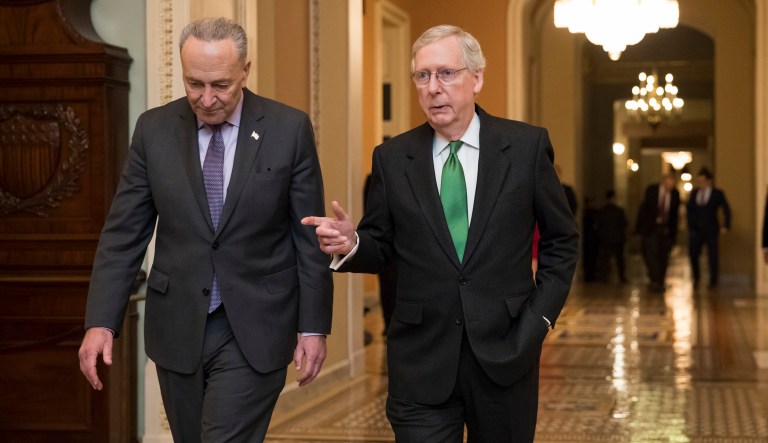 Senate Minority Leader Chuck Schumer, D-N.Y., left, and Senate Majority Leader Mitch McConnell, R-Ky., walk to the chamber after collaborating on an agreement in the Senate on a two-year, almost $400 billion budget deal that would provide Pentagon and domestic programs with huge spending increases. It would also lift the debt ceiling until March 2019. (AP Photo/J. Scott Applewhite)