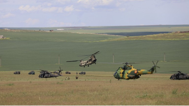 UH-60 Blackhawk and CH-47 Chinook helicopters from 3rd Battalion, 1st Combat Aviation Brigade, and IAR 330 Puma Helicopters from Baza 57 Aeriana, Mihail Kogalniceanu, Romania conducted air assault operations alongside soldiers from The Netherlands 11 Air Assault Brigade at Mihail KogÄlniceanu, Romania May. 14, 2021.