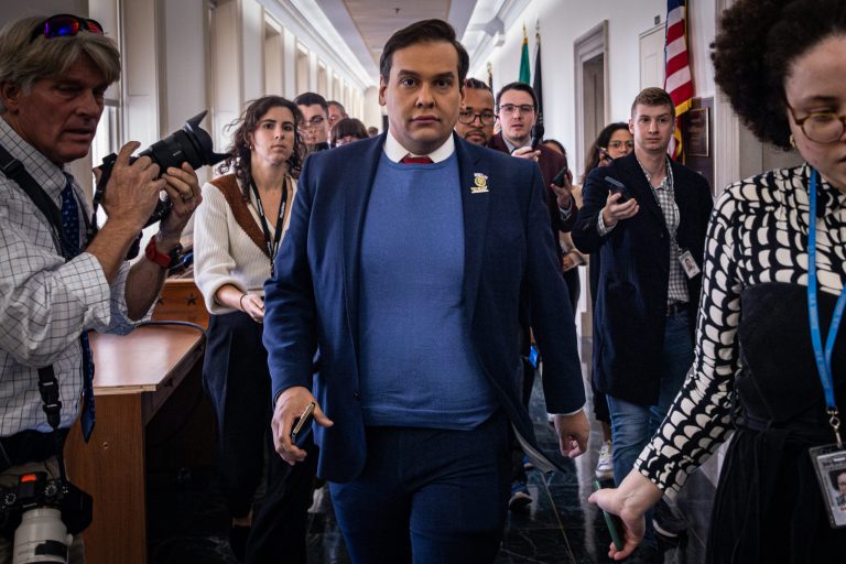 Rep. George Santos (R-NY) leaves a House Republican Conference meeting to nominate a speaker of the House, Capitol Hill, on Wednesday, Oct. 11, 2023. According to a new indictment, Santos stole the identities of donors to his campaign and then used their credit cards to make tens of thousands of dollars in unauthorized charges.