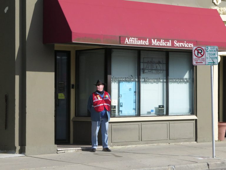 David Ritz, 65, stands as a volunteer escort outside Affiliated Medical Services, a Milwaukee abortion clinic, on Wednesday, May 28, 2014, in Milwaukee. (AP Photo)Â 
