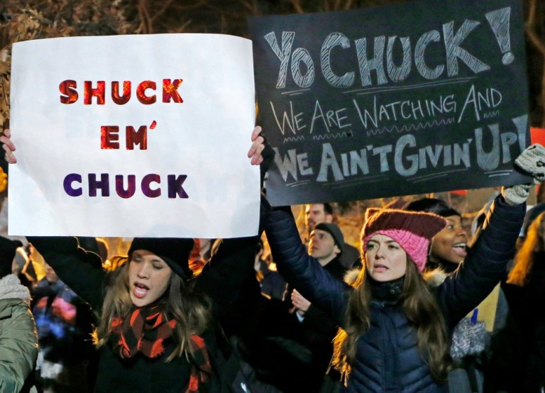 Women demonstrate across the street from the New York City residence of Senate Minority Leader Chuck Schumer during the second in a series of 