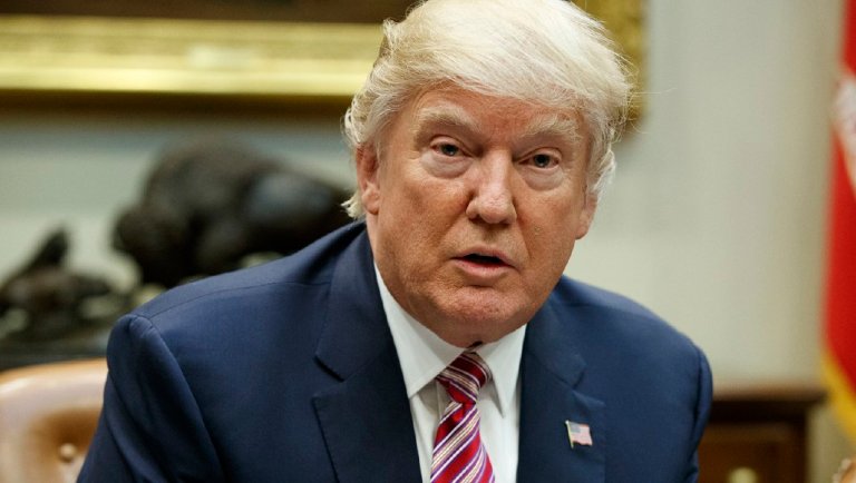 "The Failing New York Times purposely wrote a false story stating that I am unhappy with my legal team on the Russia case and am going to add another lawyer to help out. Wrong. I am VERY happy with my lawyers, John Dowd, Ty Cobb and Jay Sekulow," the president tweeted. (AP Photo/Evan Vucci)