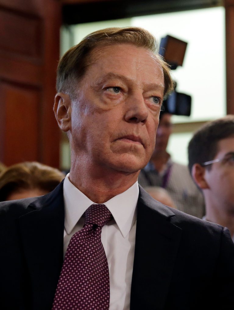FILE - In this Thursday, Sept. 18, 2014 file photo, Jamie Fox listens in Trenton, N.J., after New Jersey Gov. Chris Christie announced that he has chosen Fox to be New Jersey's new transportation commissioner. Fox's nomination flew through the state Senate on Monday, Sept. 22, 2014. The judiciary committee cleared him and then the full Senate confirmed him. In his confirmation hearing, Fox told senators that all options were on the table for accomplishing that goal, including a gas tax hike. (AP Photo/Mel Evans, File)
