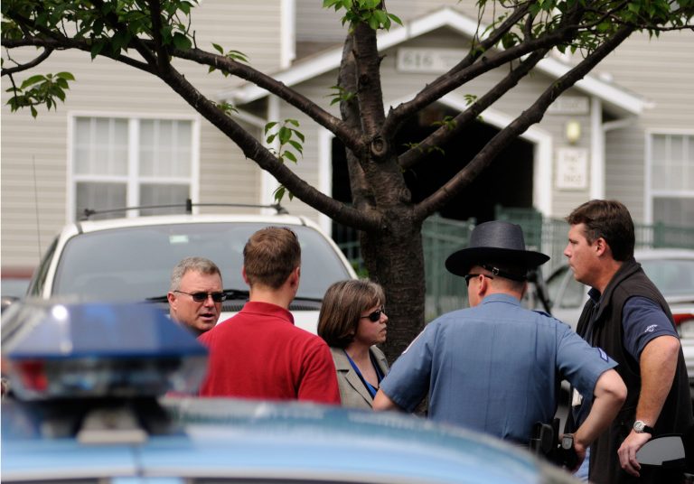 Local and federal officials talk Wednesday, June, 10, 2009 outside the home of James Von Brunn, the Holocaust Memorial Museum shooter, whom the CNN report now describes as a 